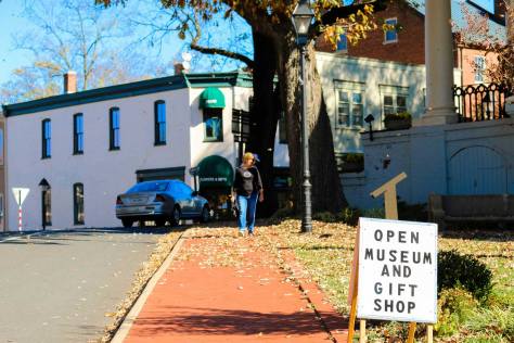 Museum gift shop sign with woman walking in Warrenton, VA
