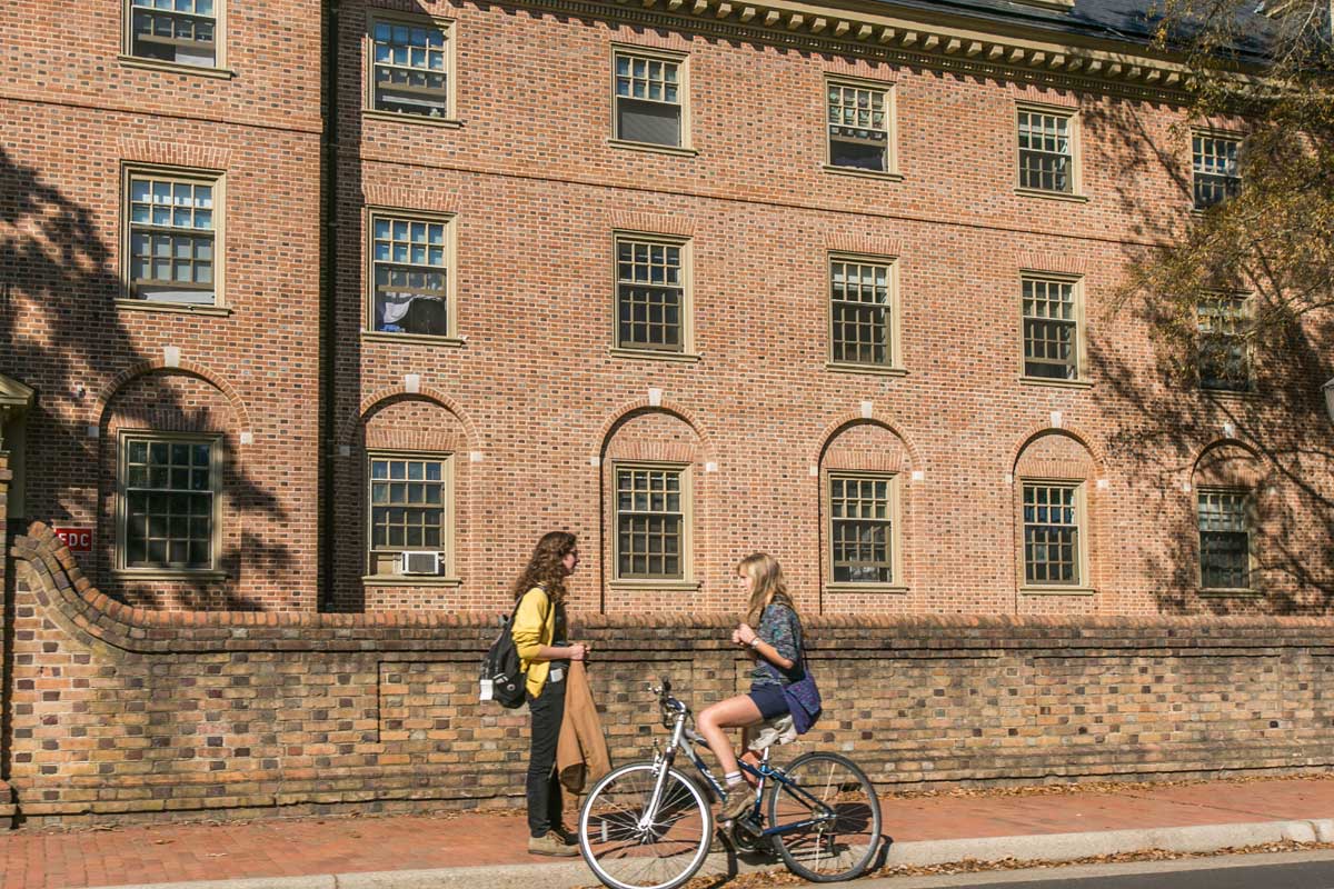 Woman talking to another woman on a bicycle in Williamsburg, VA