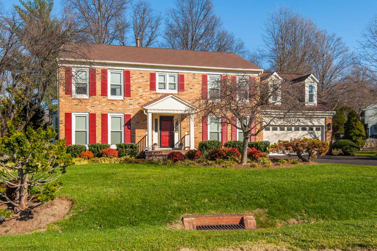 Brick single family home red shutters in Olney, MD