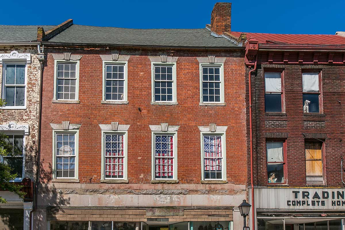 Building with American flags in windows in Petersburg, VA