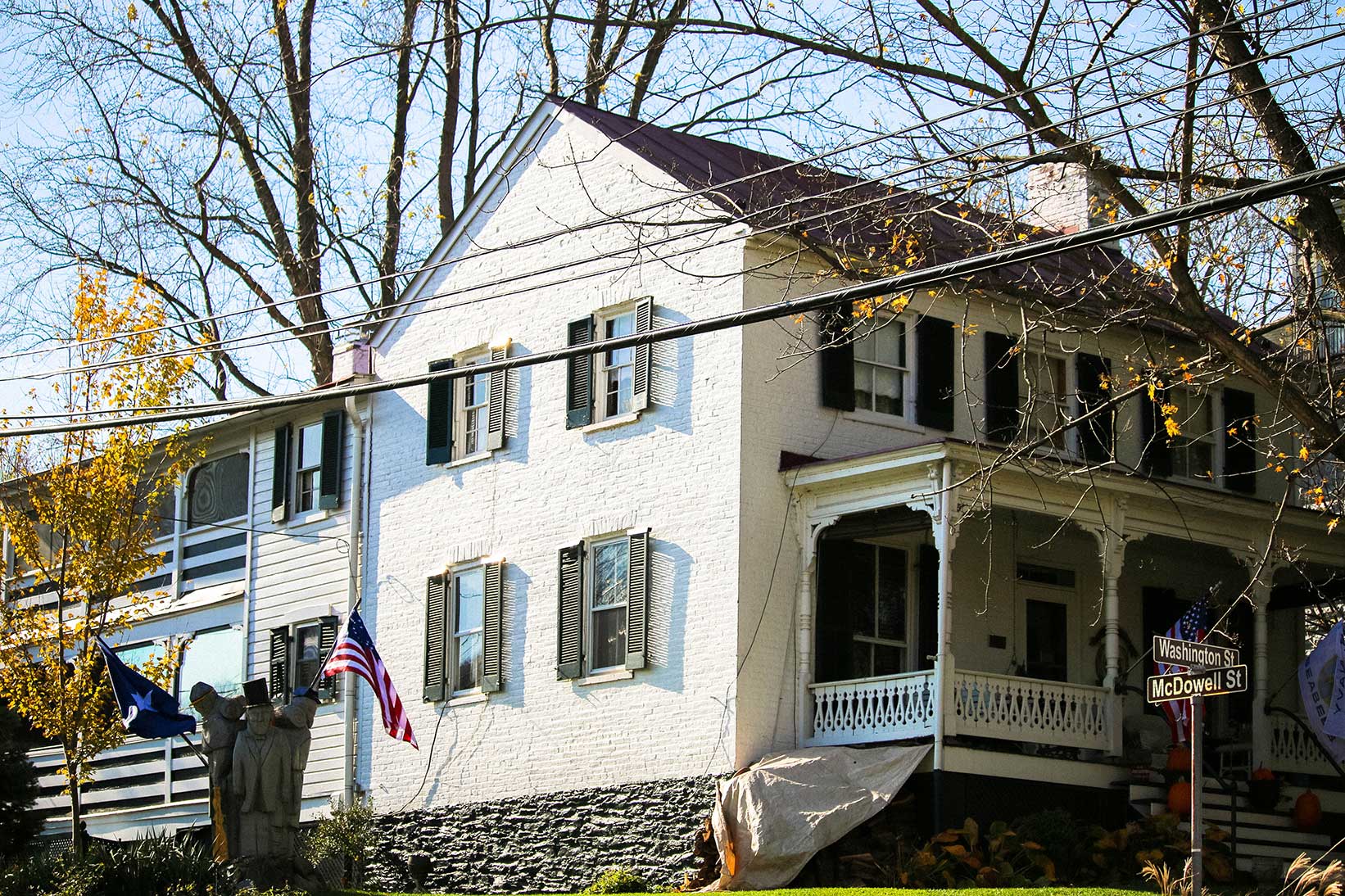 White single family home with statue in Harper's Ferry, WV